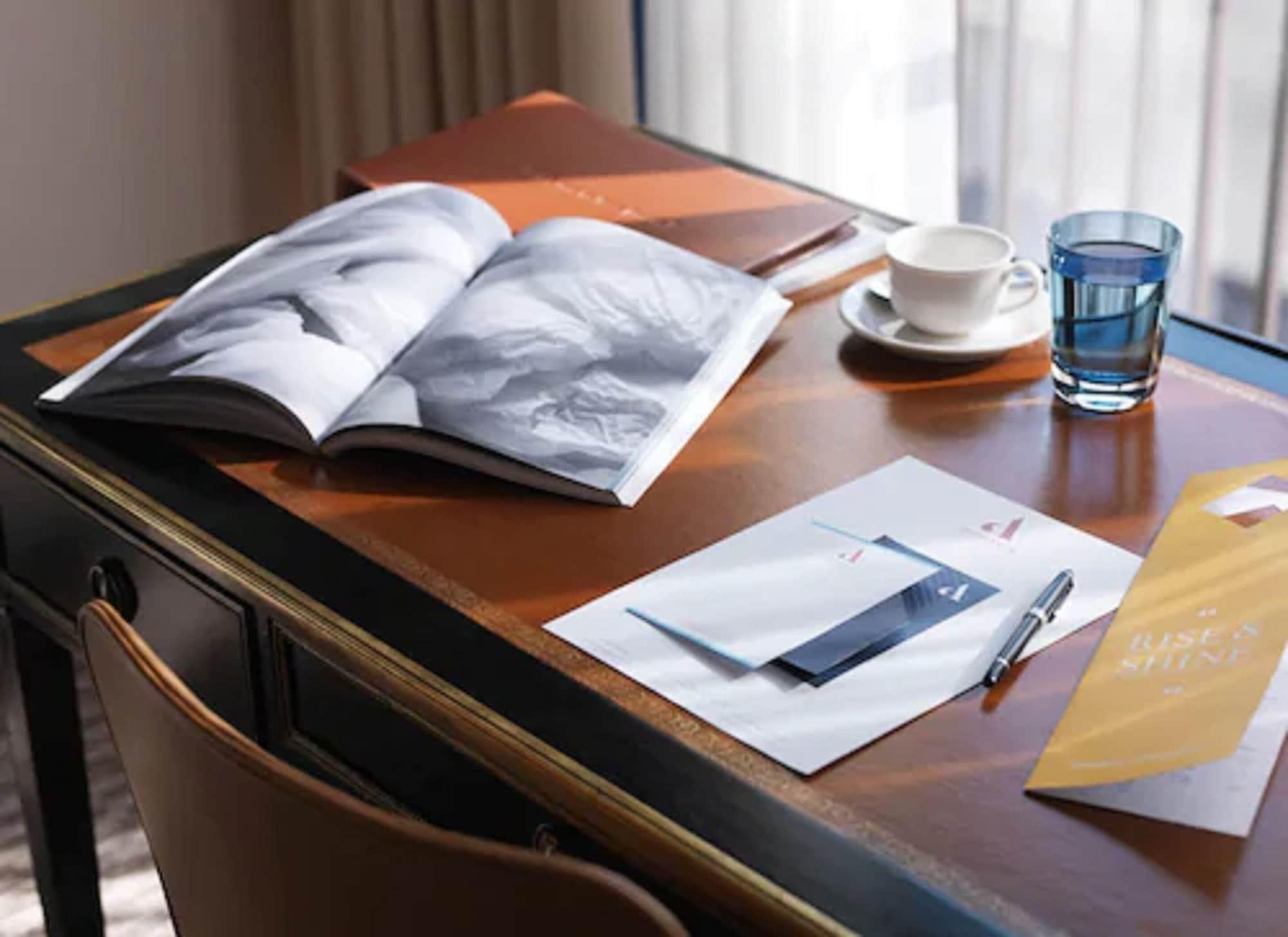 The Athenaeum Hotel & Residences London Exterior photo A desk with a book and a glass of water